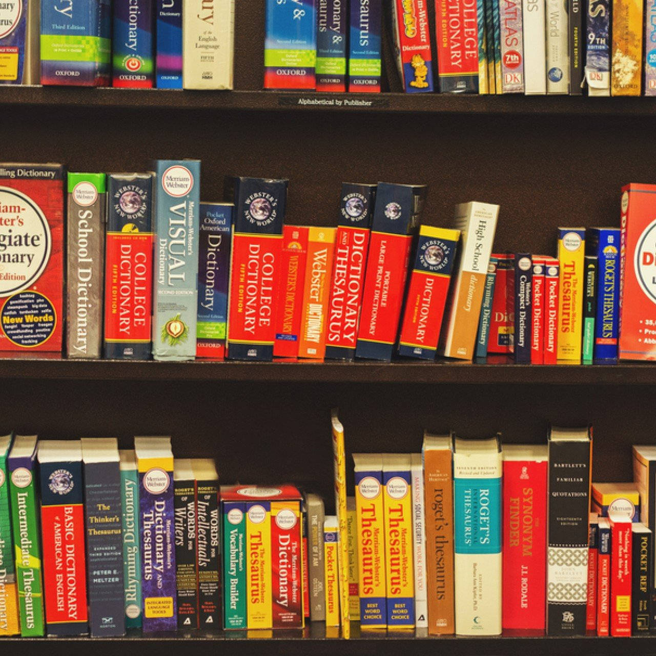 Assorted Dictionary In A Book Shelf Wallpaper