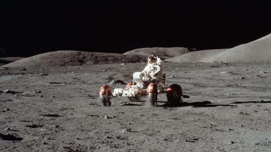 Astronaut Exploring The Moon With Lunar Rover Wallpaper