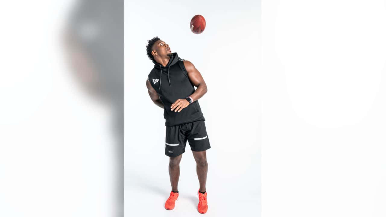 Athlete Tossing Football Studio Shot Wallpaper