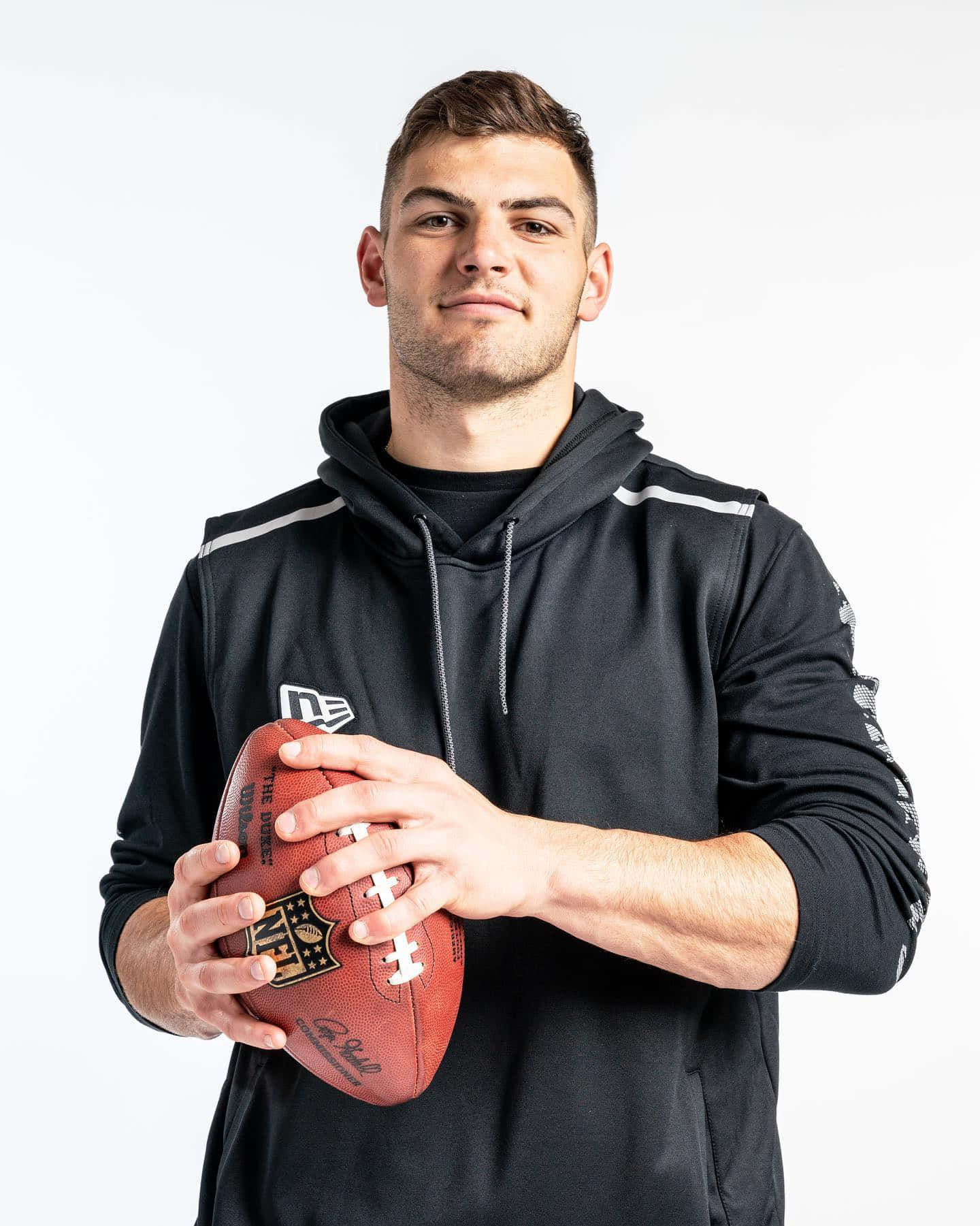 Athlete With Football Portrait Wallpaper