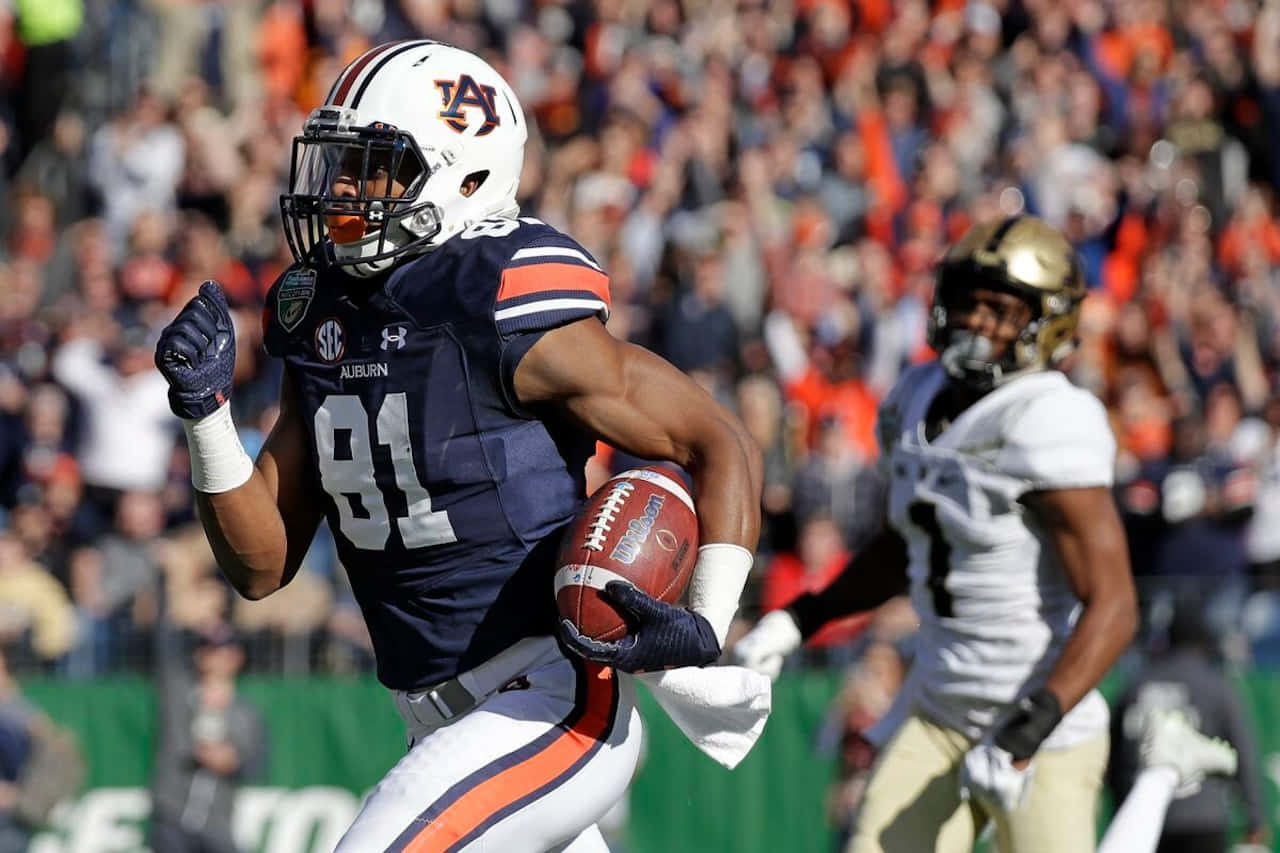 Auburn Football Player Running With Ball Wallpaper