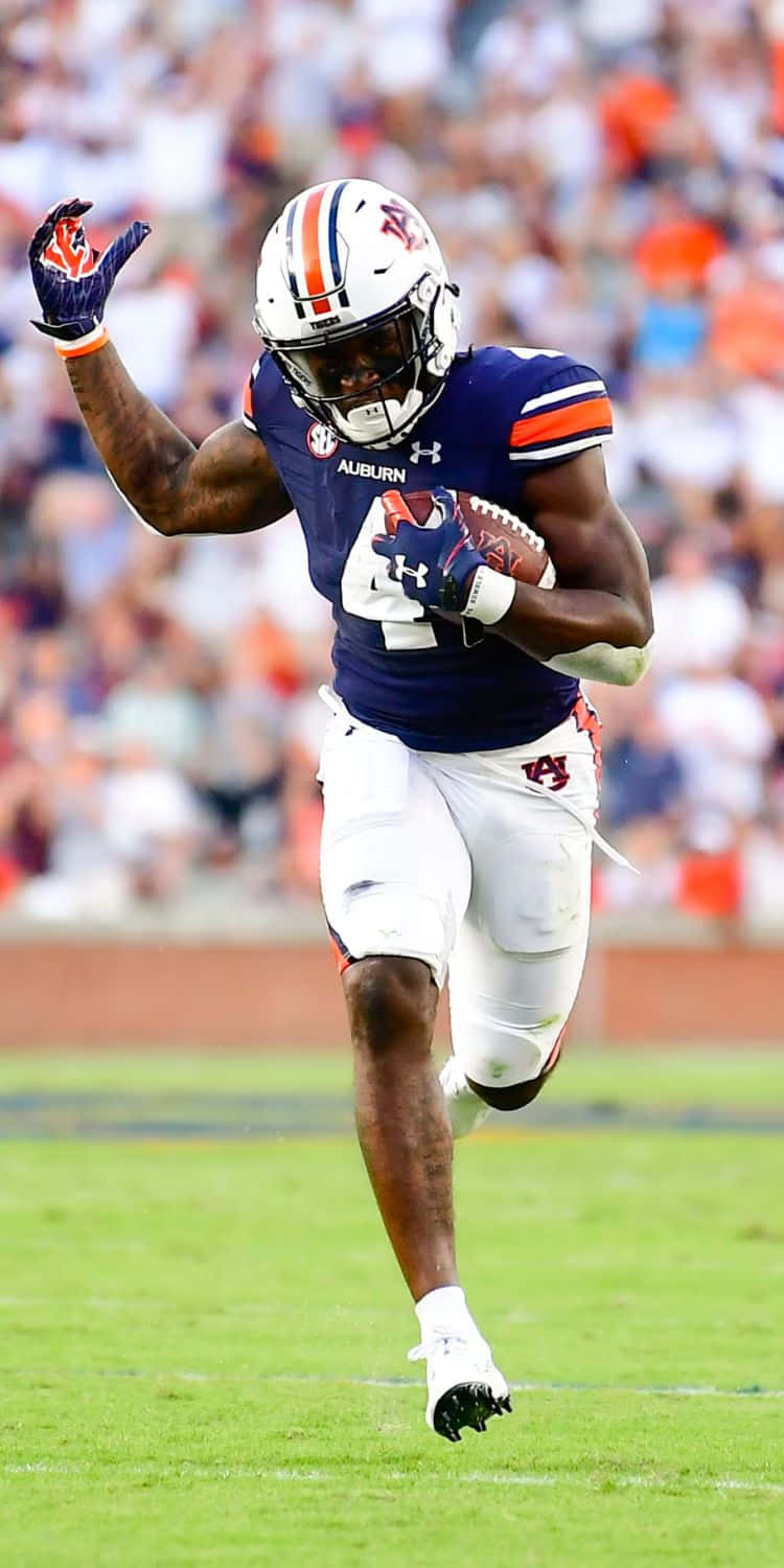 Auburn Football Player Running With Ball Wallpaper