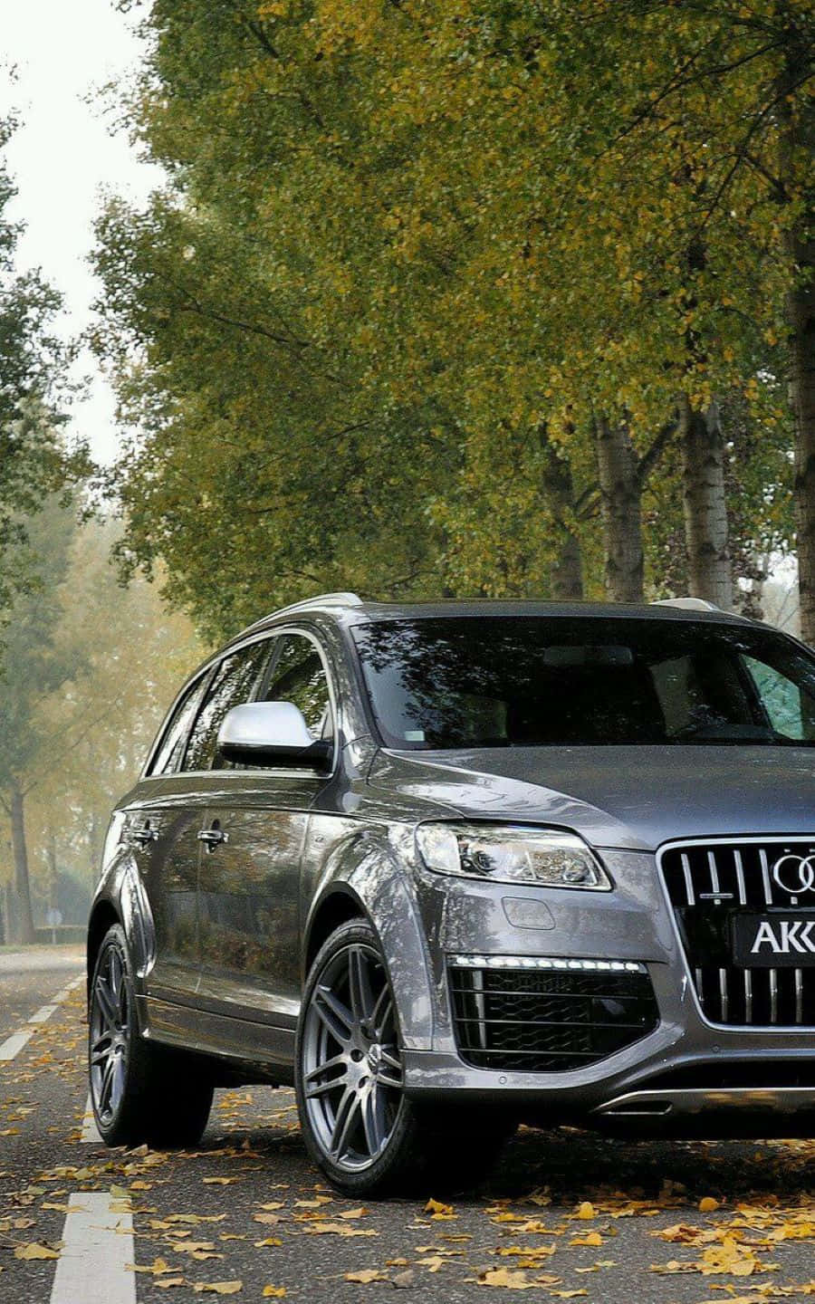 Audi Q7 Suv In Night Cityscape Wallpaper