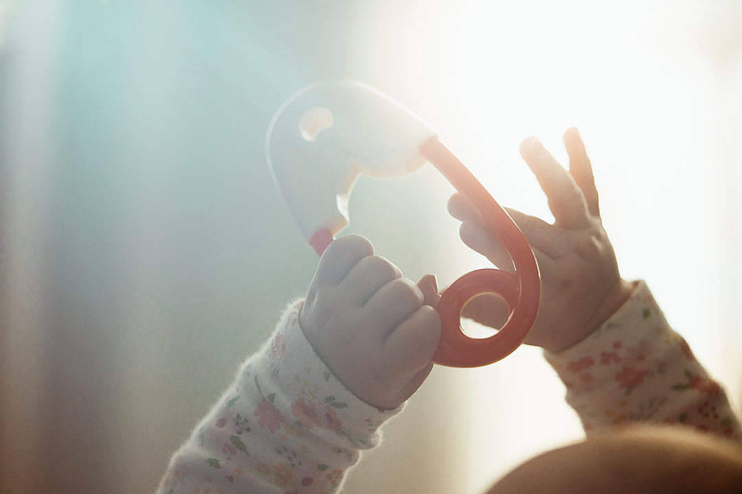 Baby Boy Playing With Toy Wallpaper