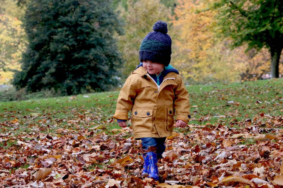 Baby Boy Wearing Cozy Brown Jacket Wallpaper