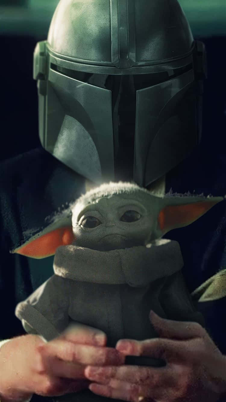 Baby Yoda Being Held Iphone Wallpaper