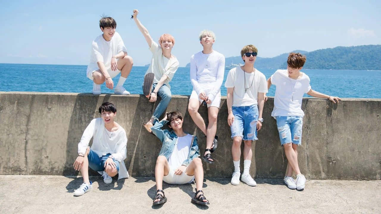 Bangtan Sonyeondan Poses Together In A Group Photo Wallpaper