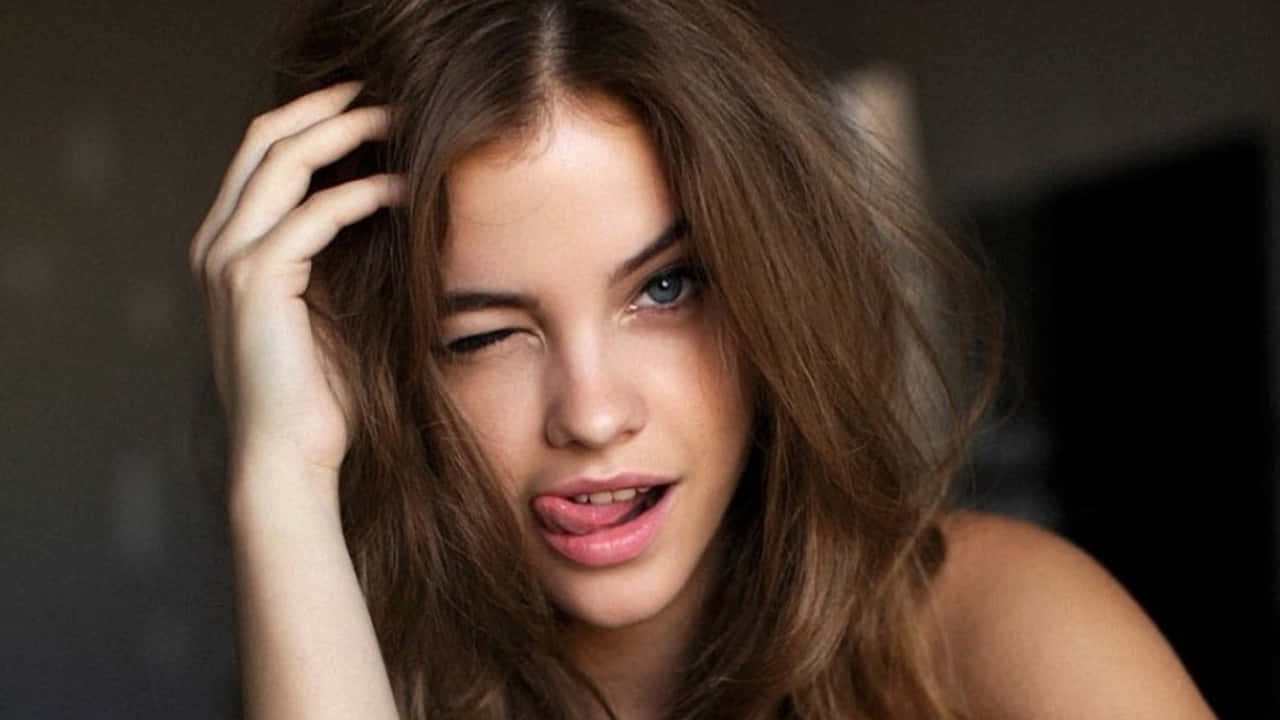 Barbara Palvin Expressive Tongue Out Pose Wallpaper