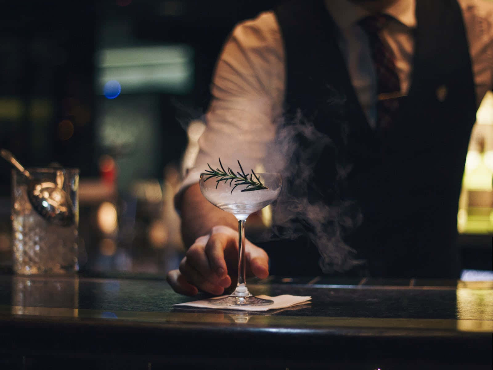 Bartender Serving Smoky Cocktail Wallpaper