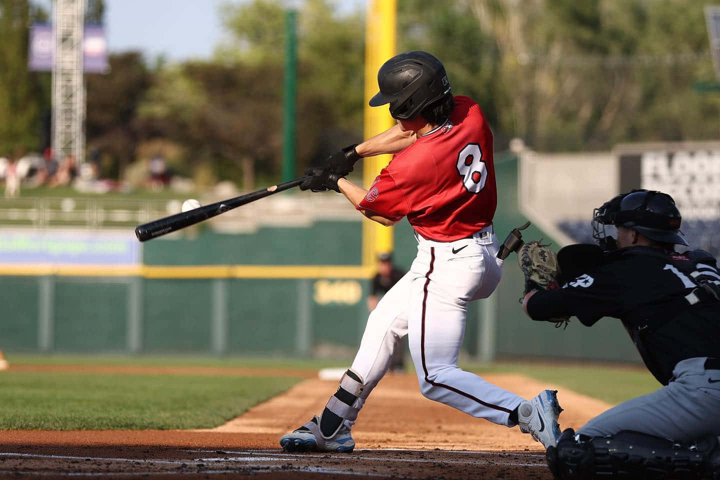 Baseball Player Hitting Ball During Game.jpg Wallpaper