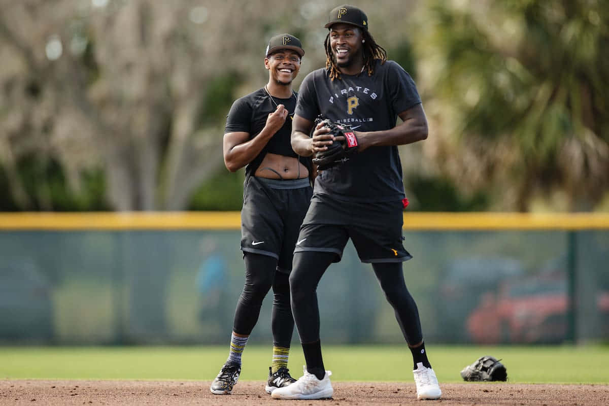 Baseball Players Laughing During Practice Wallpaper