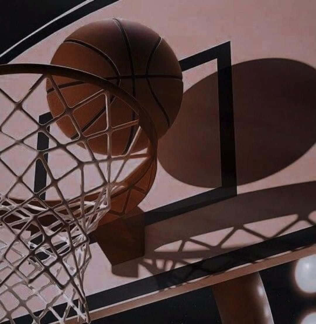 Basketball Approaching Hoop Moment Wallpaper