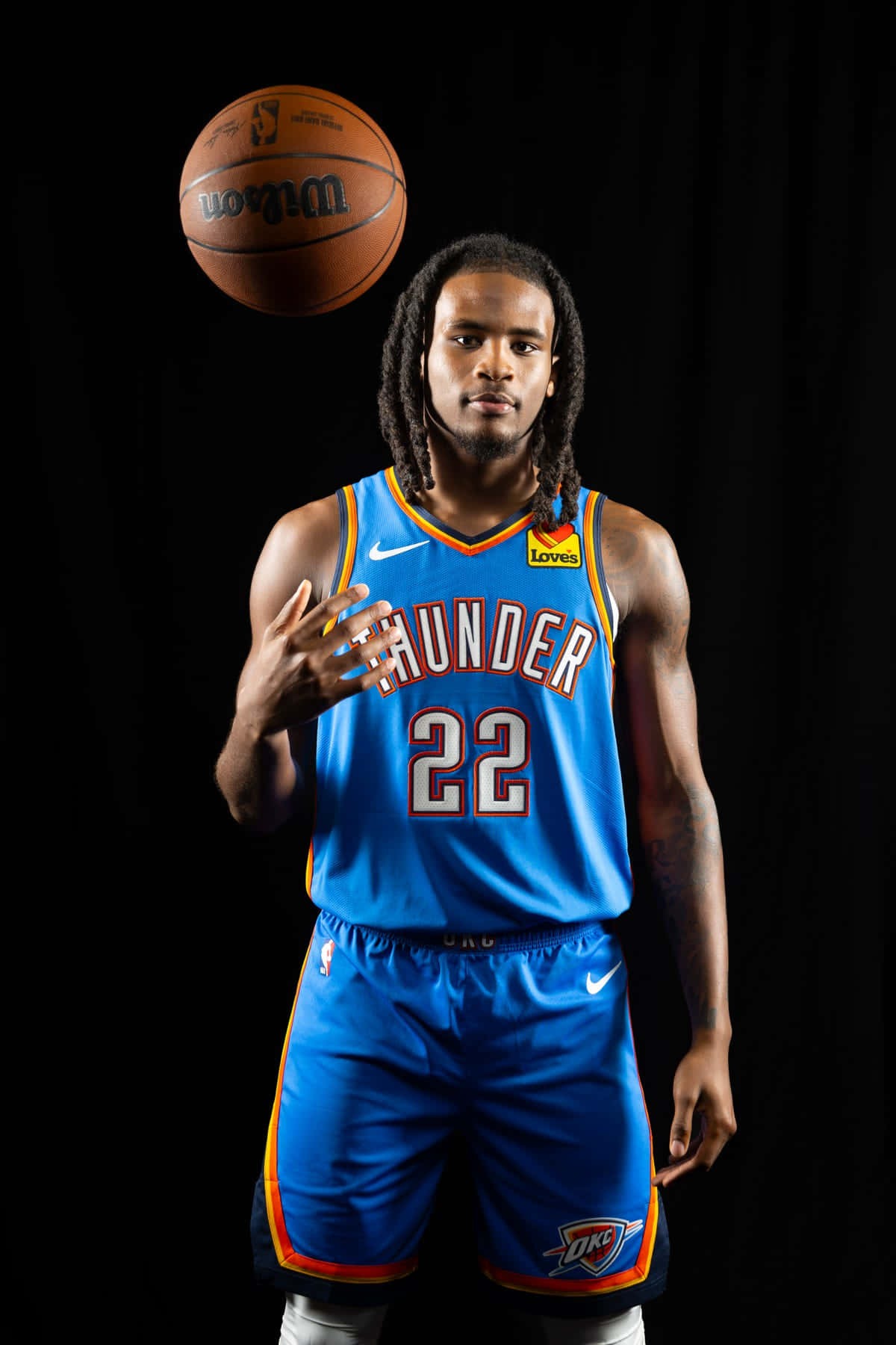 Basketball_ Player_ Spinning_ Ball_ Oklahoma_ City_ Thunder_ Uniform Wallpaper