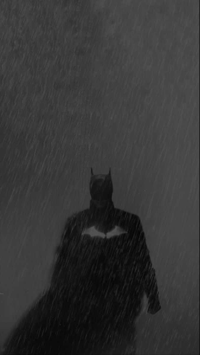 Batman Poised Heroically In Stunning Black And White Wallpaper