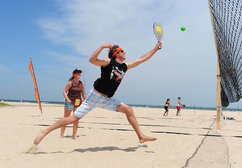 Beach Tennis Doubles Action Wallpaper