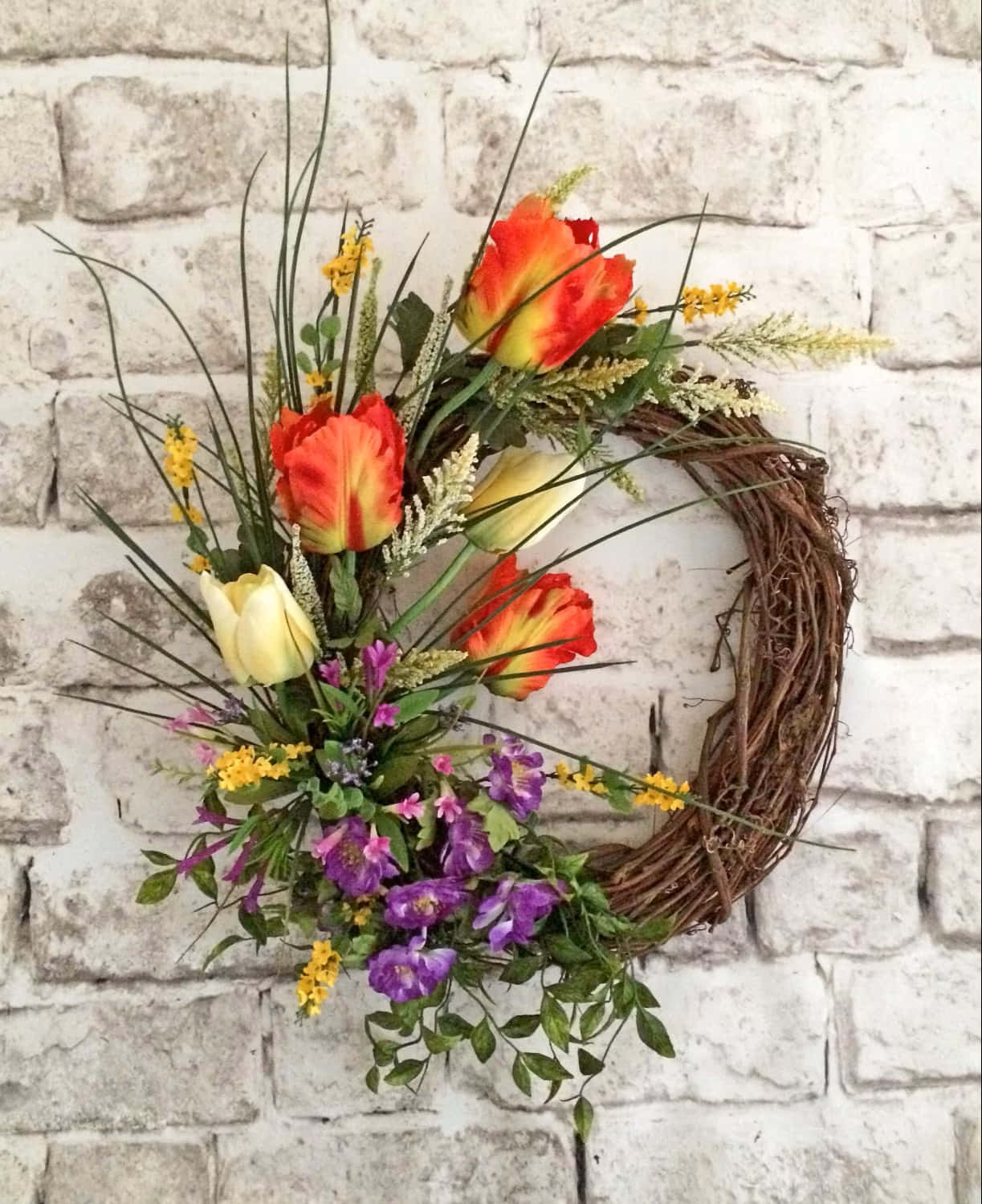 Beautiful And Vibrant Spring Wreath On A Wooden Door Wallpaper