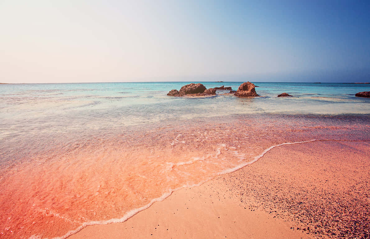 Beautiful Pink Sand Beach At Sunset Wallpaper