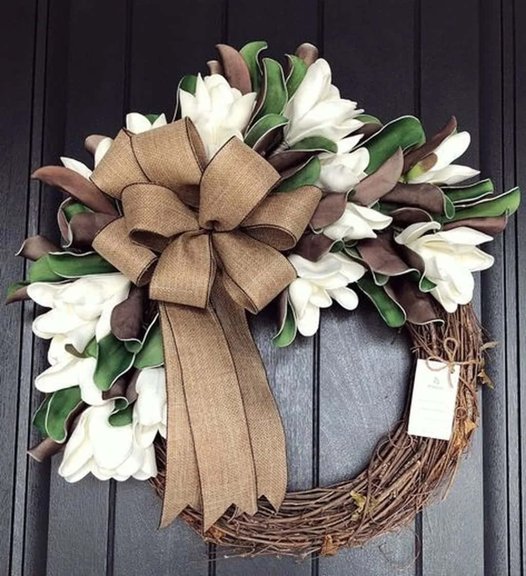 Beautiful Spring Wreath Adorning A Rustic Wooden Door Wallpaper