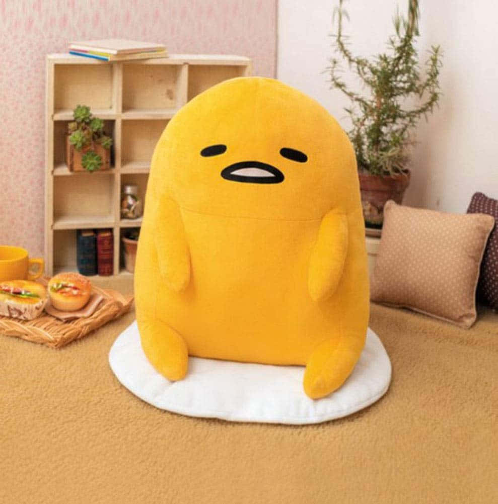 Big Gudetama Plushie On Carpet Wallpaper