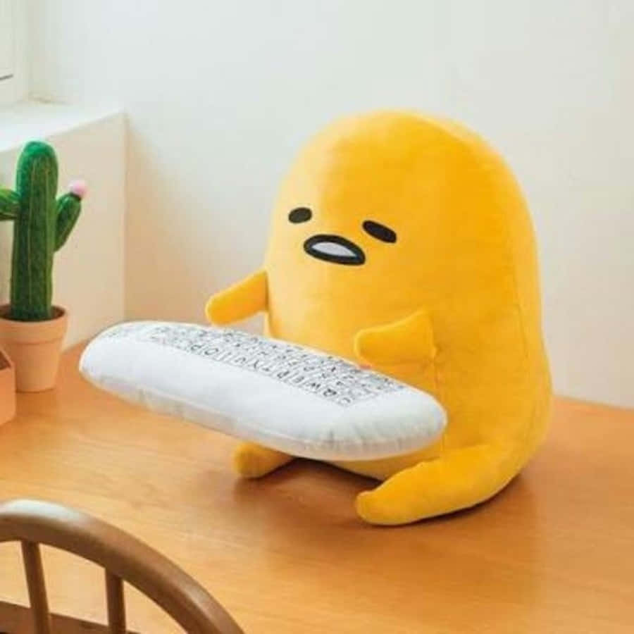 Big Gudetama With Keyboard Pillow Wallpaper