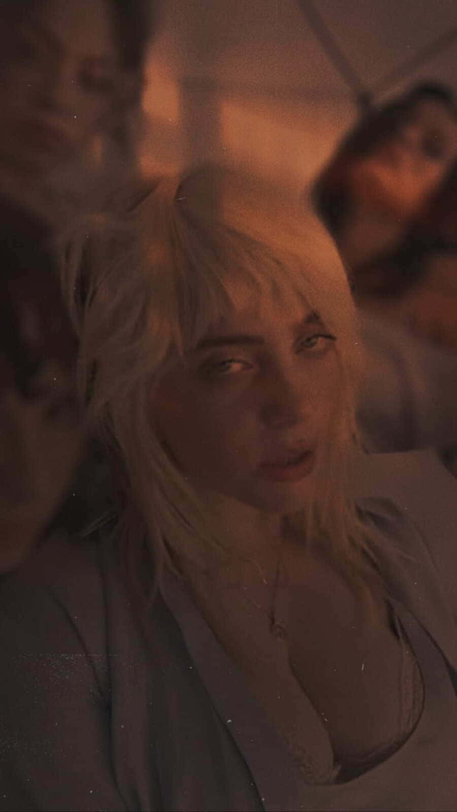 Billie Eilish Somber Expression Wallpaper