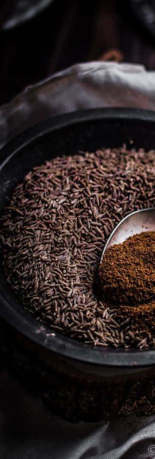 Black Cumin Seeds, A Key Ingredient Of The World-renowned Spice Blend, Is Depicted In This Image. Wallpaper