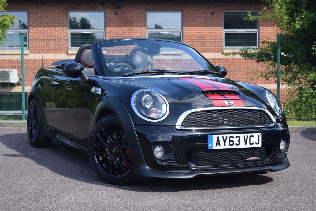 Black Mini Roadster Parked Outdoors Wallpaper