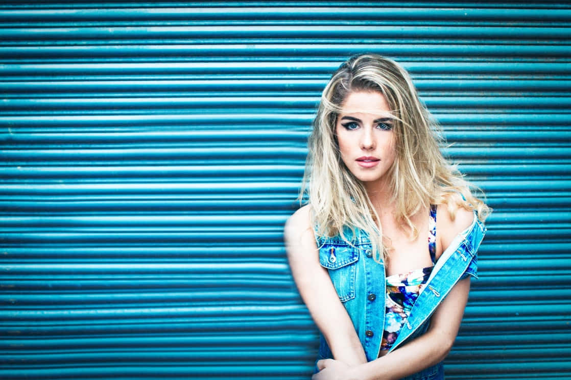 Blonde Woman Denim Vest Blue Background Wallpaper