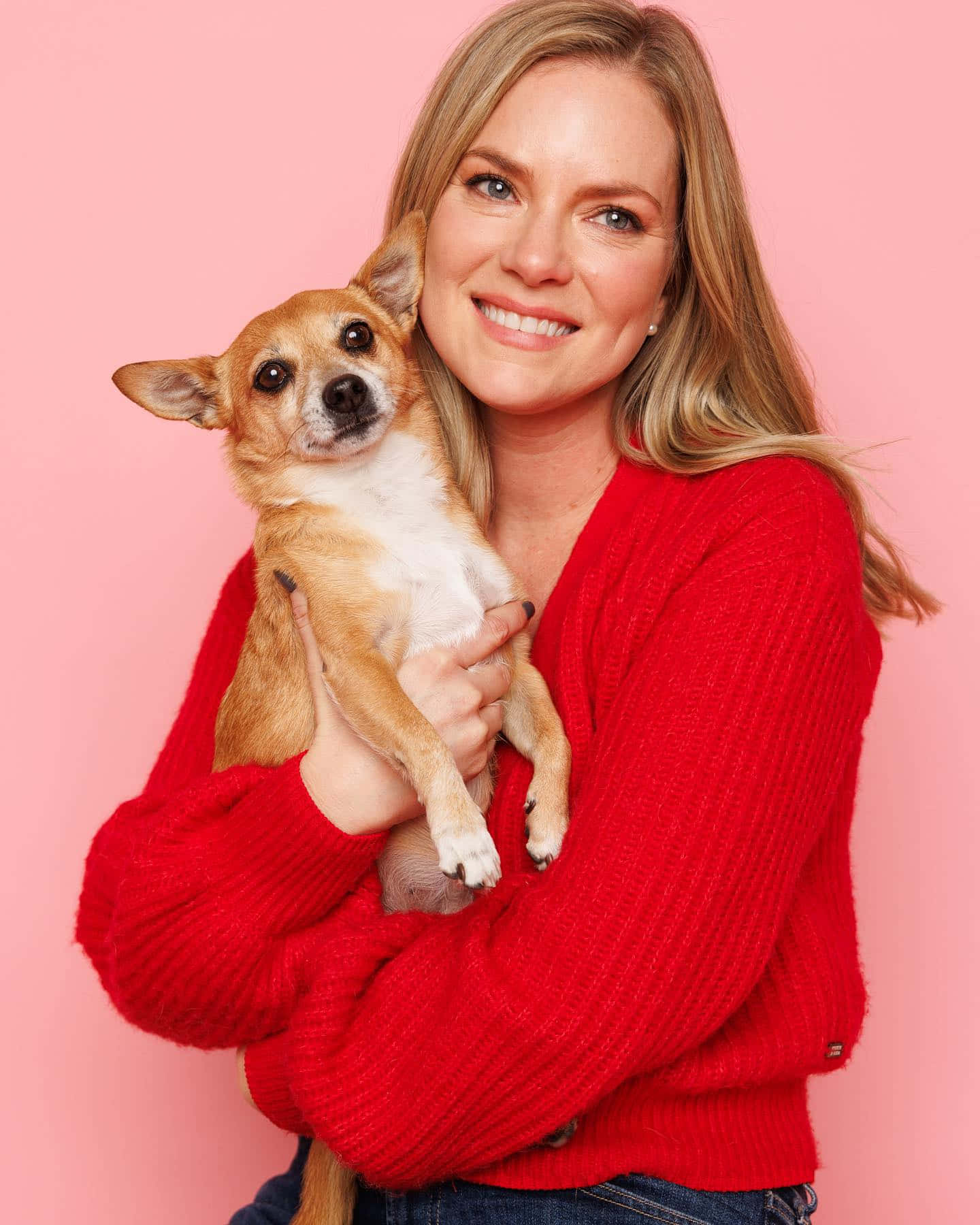 Blonde Woman Holding Dogin Red Sweater Wallpaper