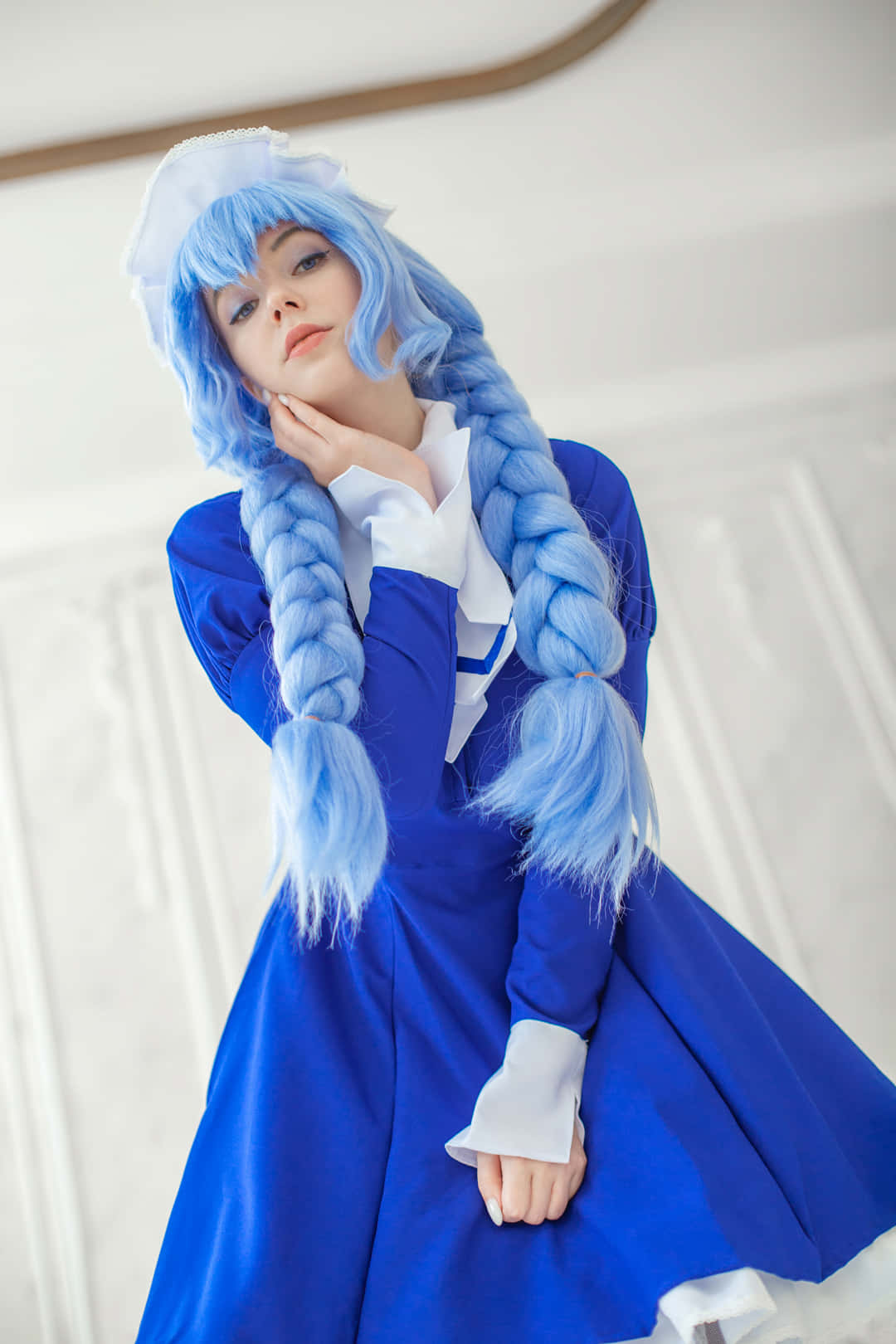 Blue Haired Cosplayerin Whiteand Blue Outfit Wallpaper