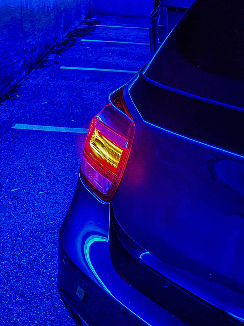 Blue Hued Car In Parking Lot Wallpaper