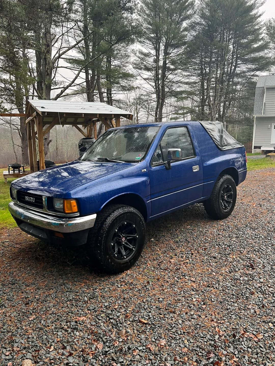 Blue Isuzu Amigo Parked Outdoors Wallpaper