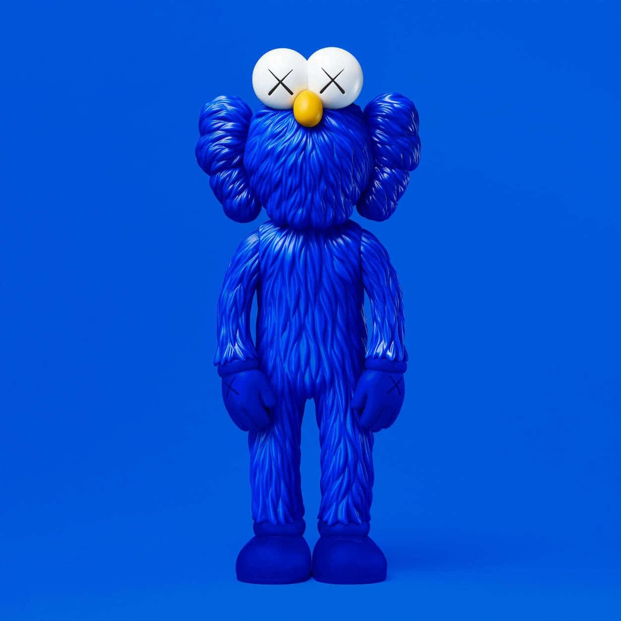 Blue Kaws Figure Against Blue Background Wallpaper