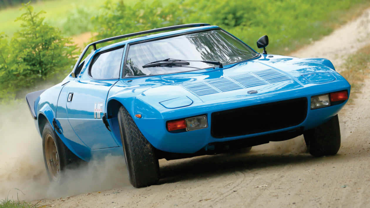 Blue Lancia Stratos Rallyingon Dirt Wallpaper