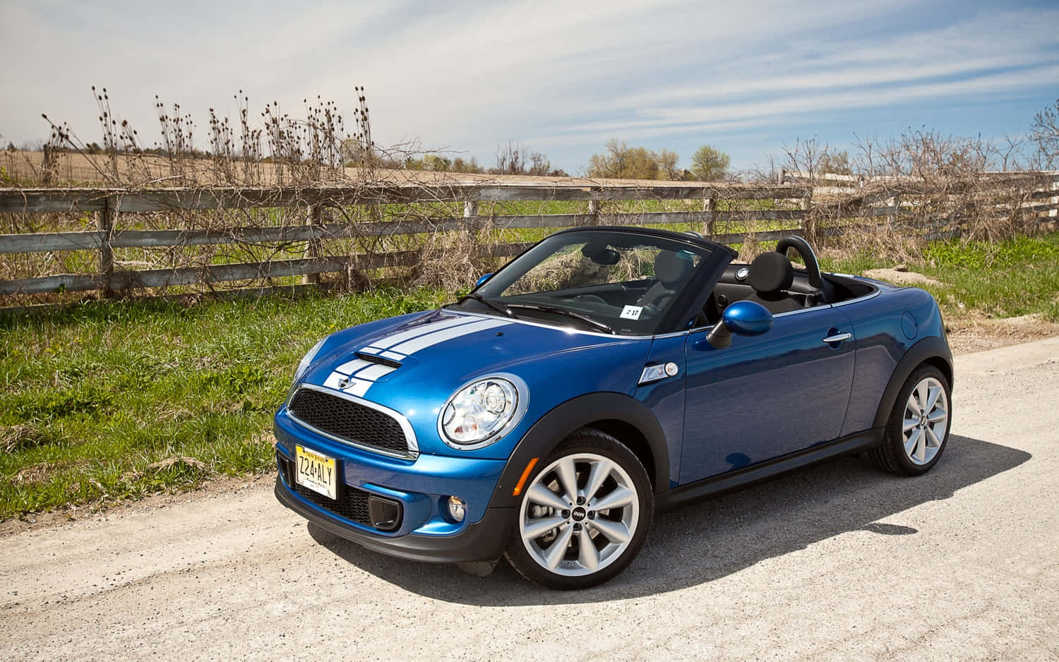 Blue Mini Roadster Convertible Parked Outdoors Wallpaper