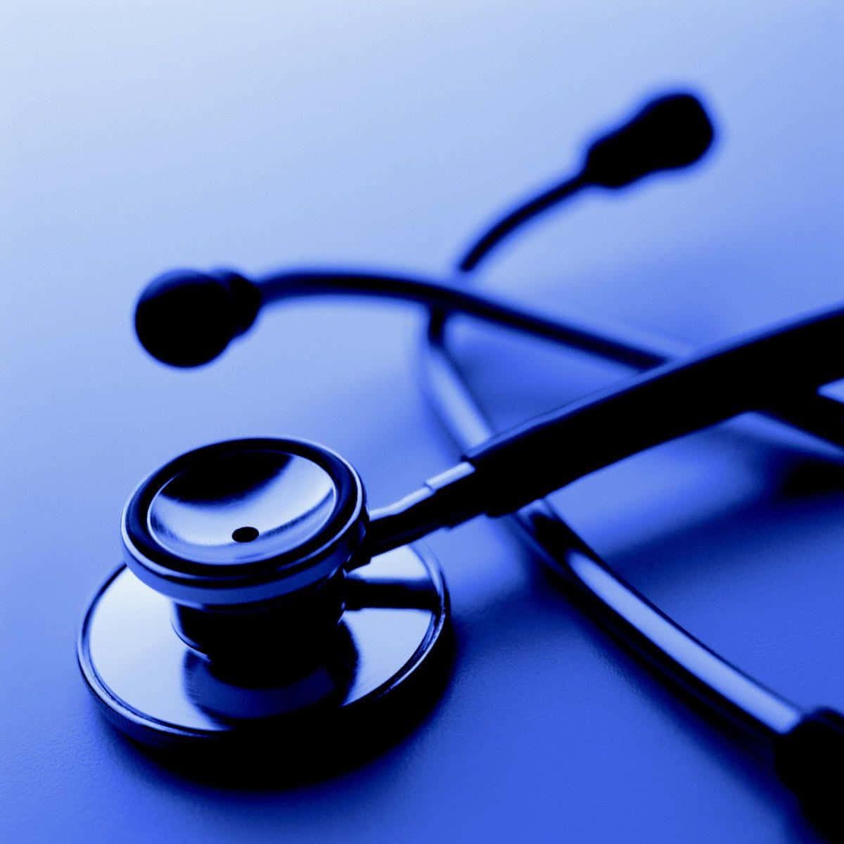 Blue Tinted Stethoscope Medical Equipment Wallpaper