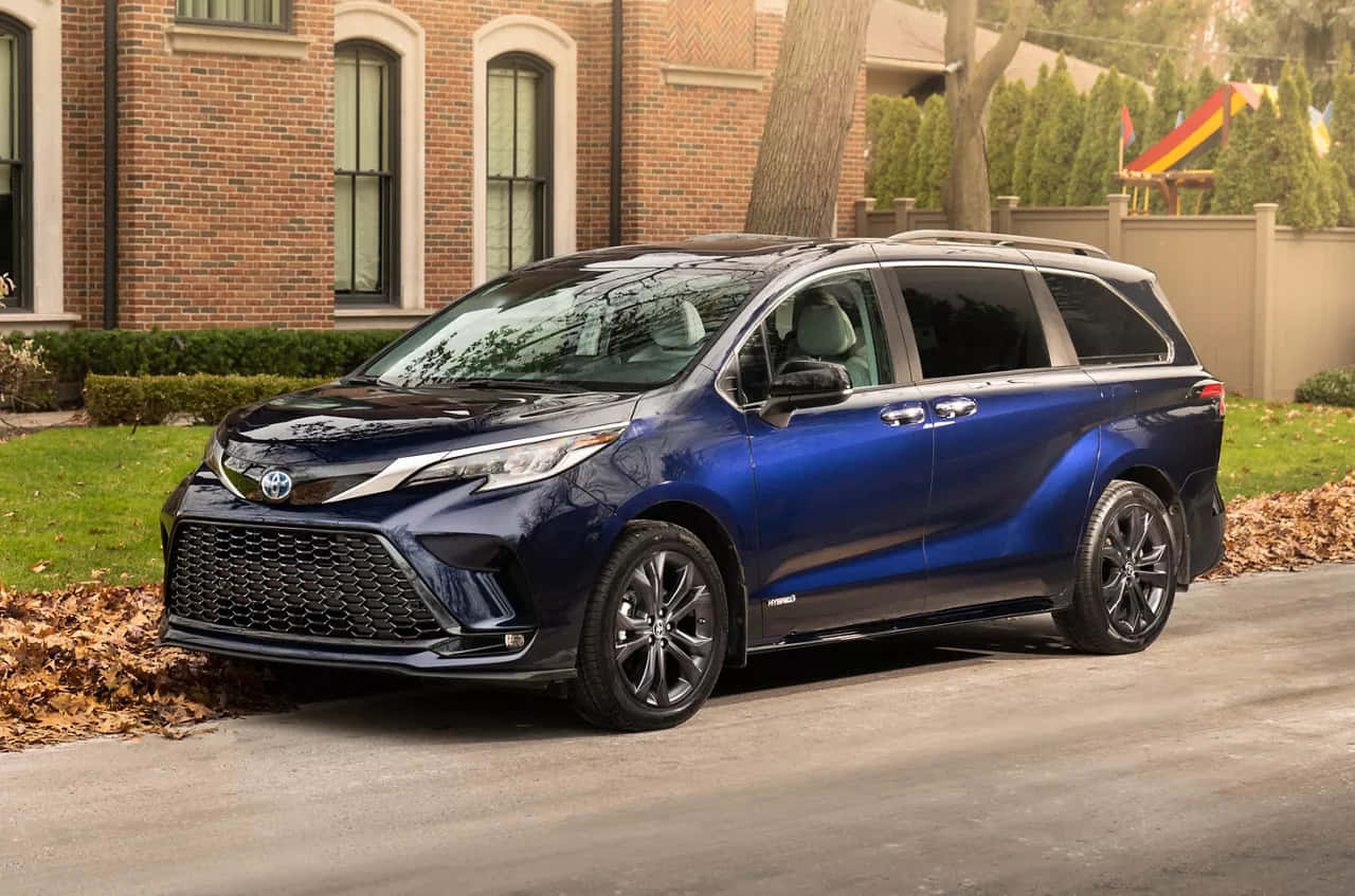 Blue Toyota Sienna Minivan Parked Residential Area Wallpaper