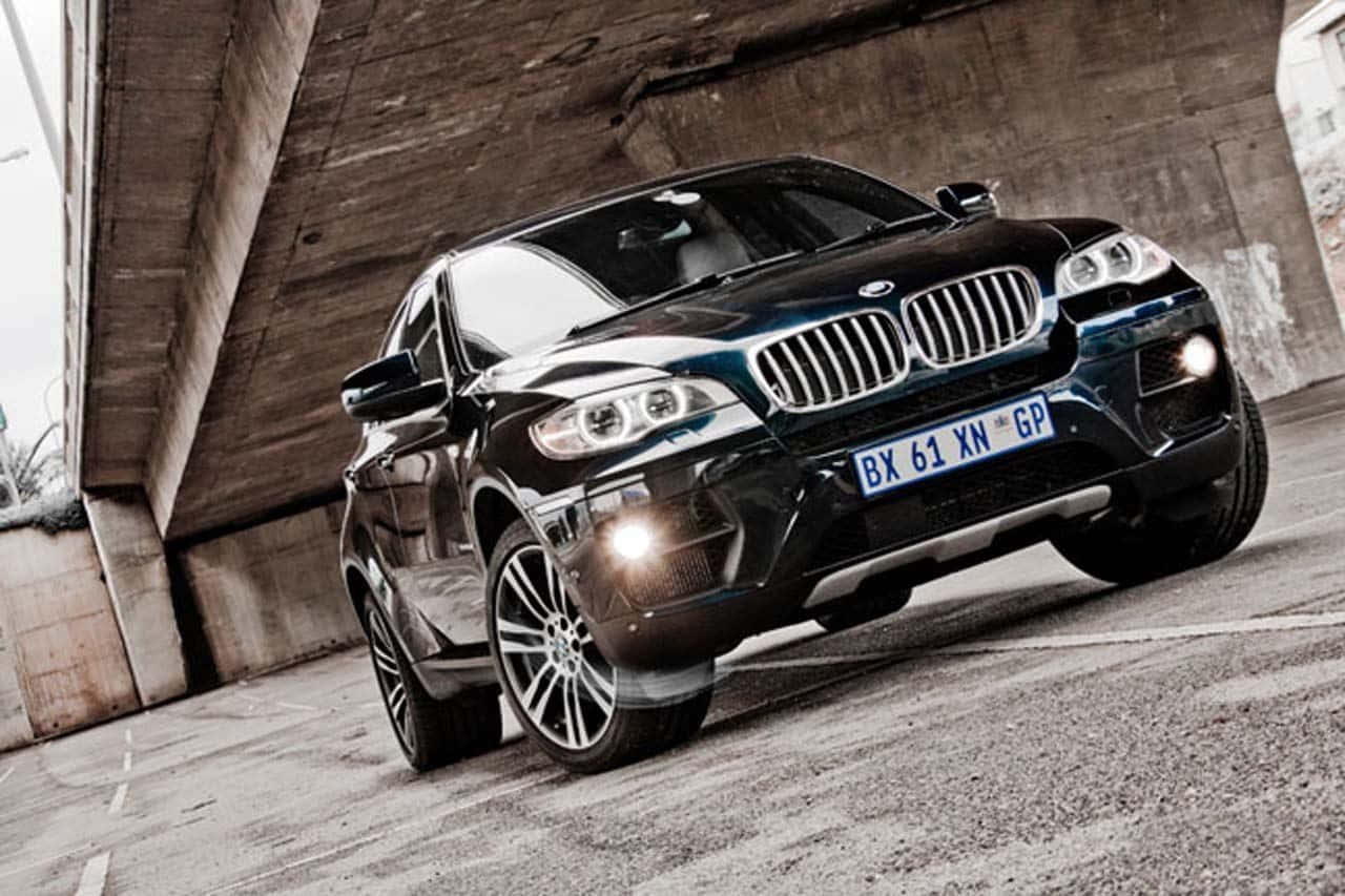 Bmw X6 - The Ultimate Driving Machine On The Road Wallpaper