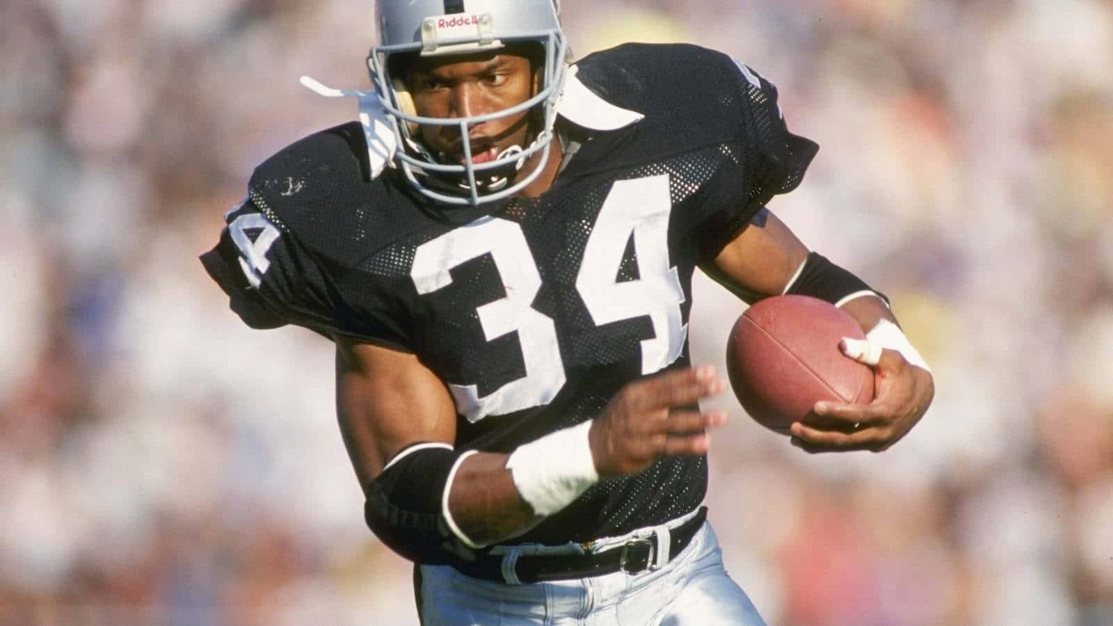 Bo Jackson Protecting A Football Wallpaper