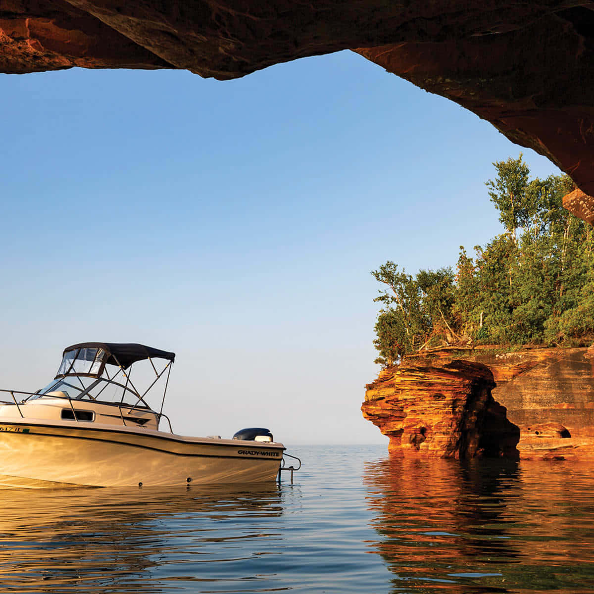 Boat Near Sea Cave Wallpaper