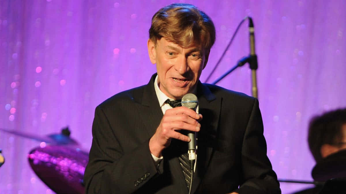 Bobby Caldwell Performing Live On Stage Wallpaper