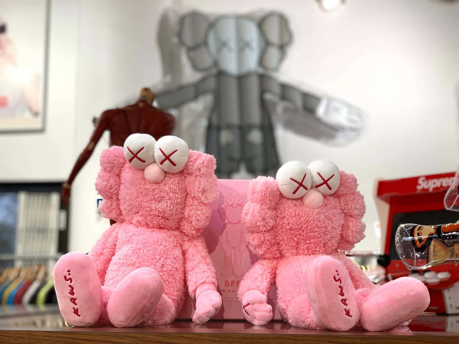 Bold And Vibrant Kaws Bff Pink Artwork Wallpaper