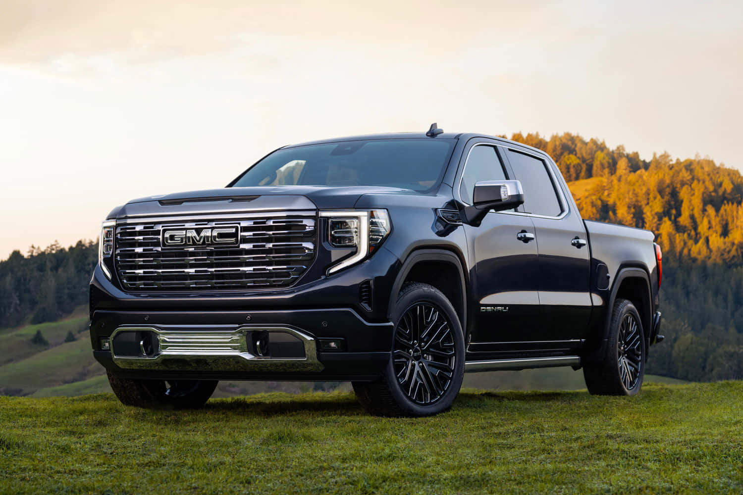 Bold Gmc Sierra 1500 Cruising Through Rugged Terrain Wallpaper