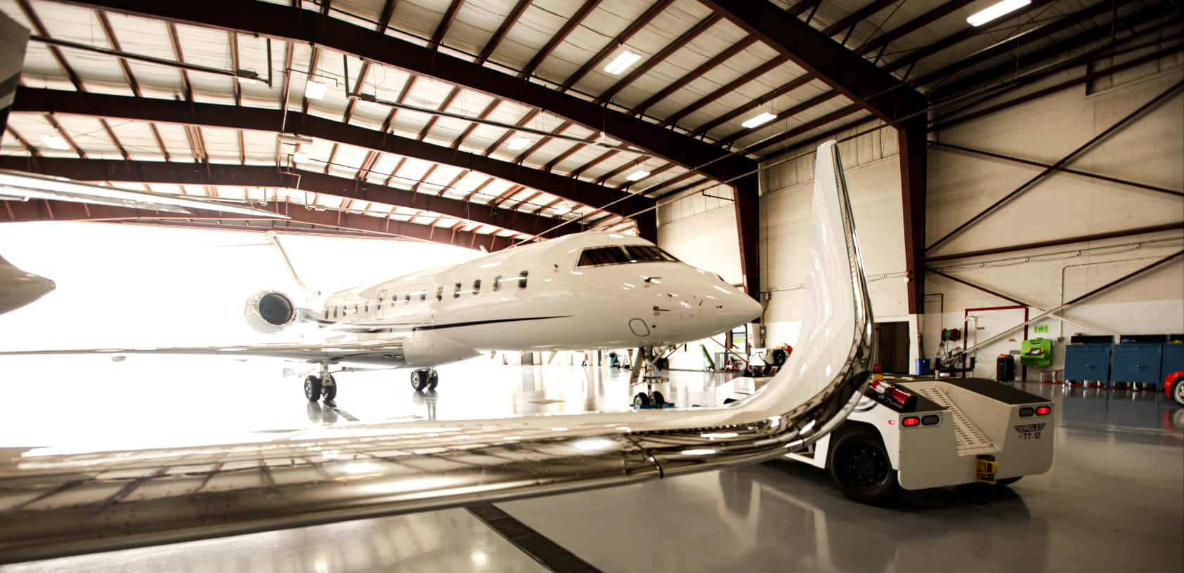 Bombardier Global Express Small Airplane On Hangar Wallpaper