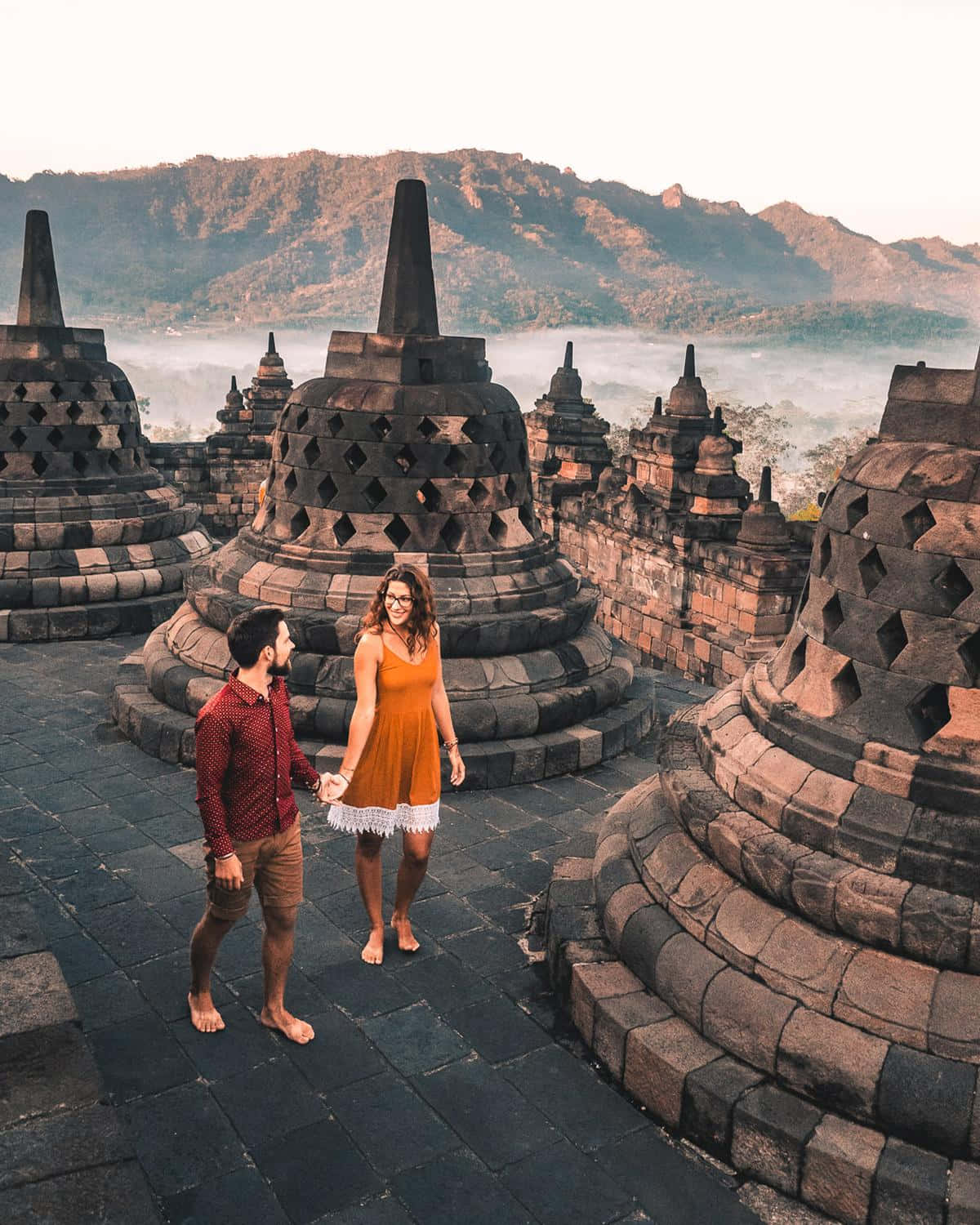 Borobudur Temple Couple Holding Hands Wallpaper