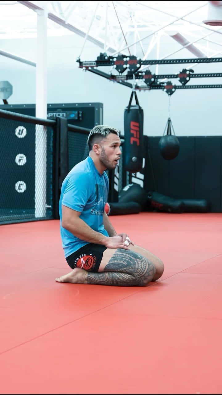 Brad Tavares Sitting In The Gym Wallpaper