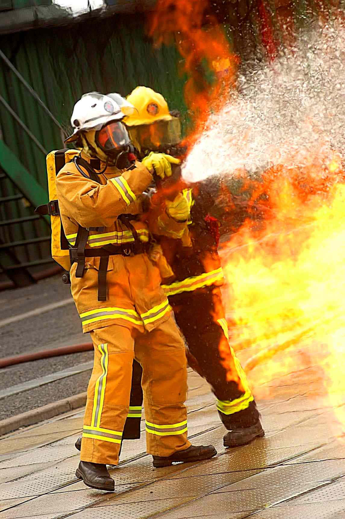 Brave Firefighter Communicating Via Phone Wallpaper