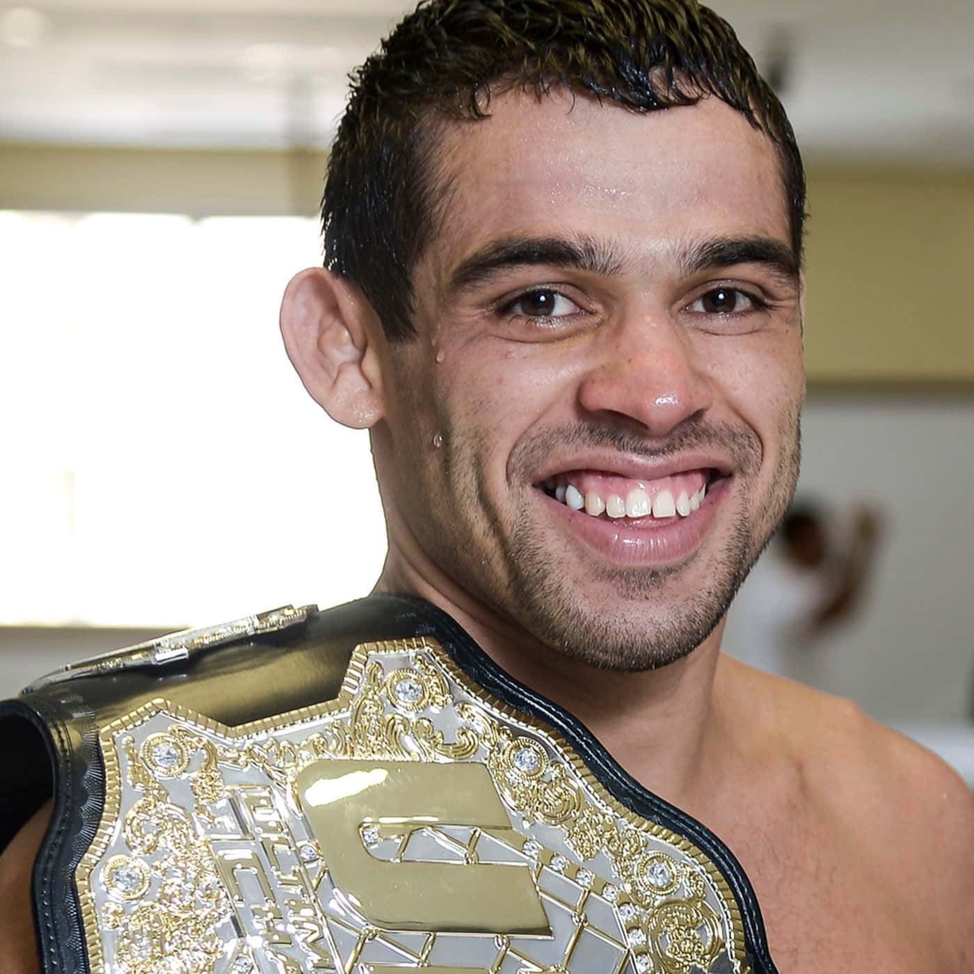 Brazilian Mixed Martial Artist Renan Barão With Ufc Belt Wallpaper