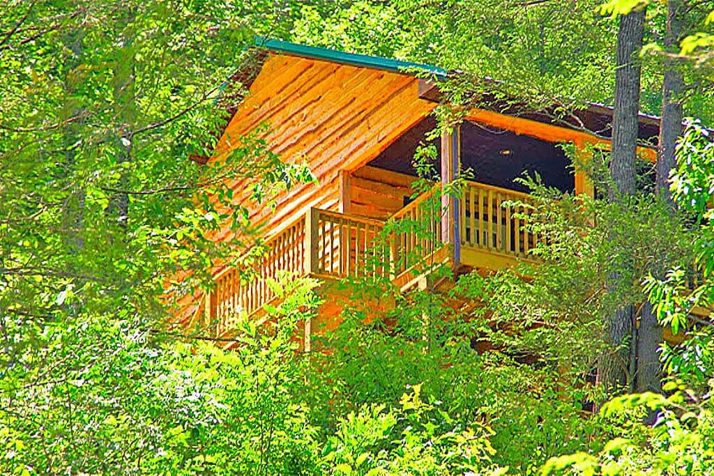 Breathtaking Fall Colors Surrounding A Rustic Cabin Wallpaper