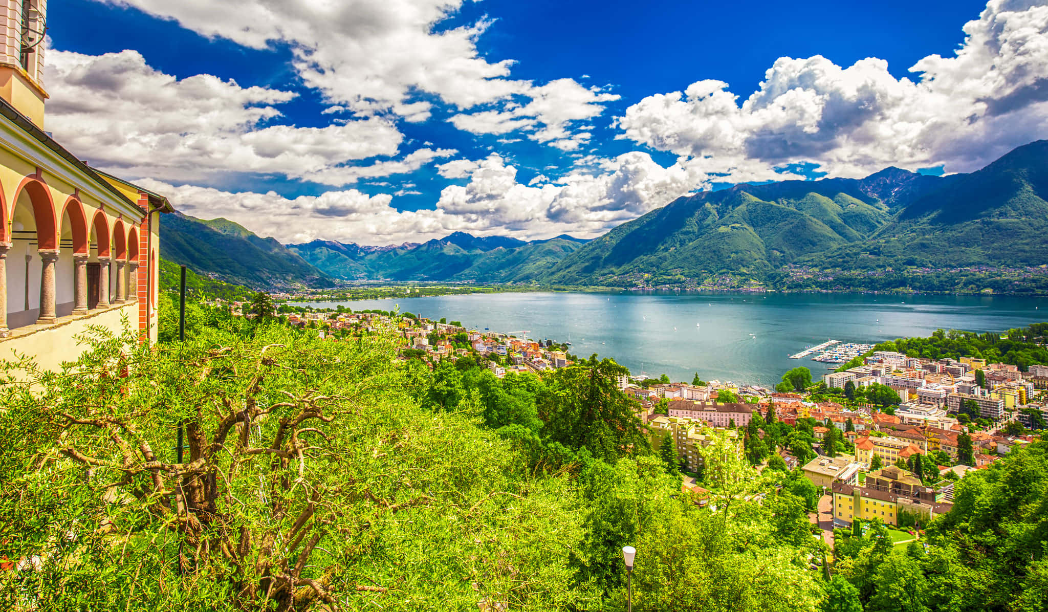 Breathtaking Panorama Of Locarno's Lakeside Scenery Wallpaper